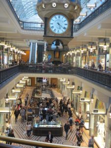 One of the famous clocks suspended in the Queen Victoria Building